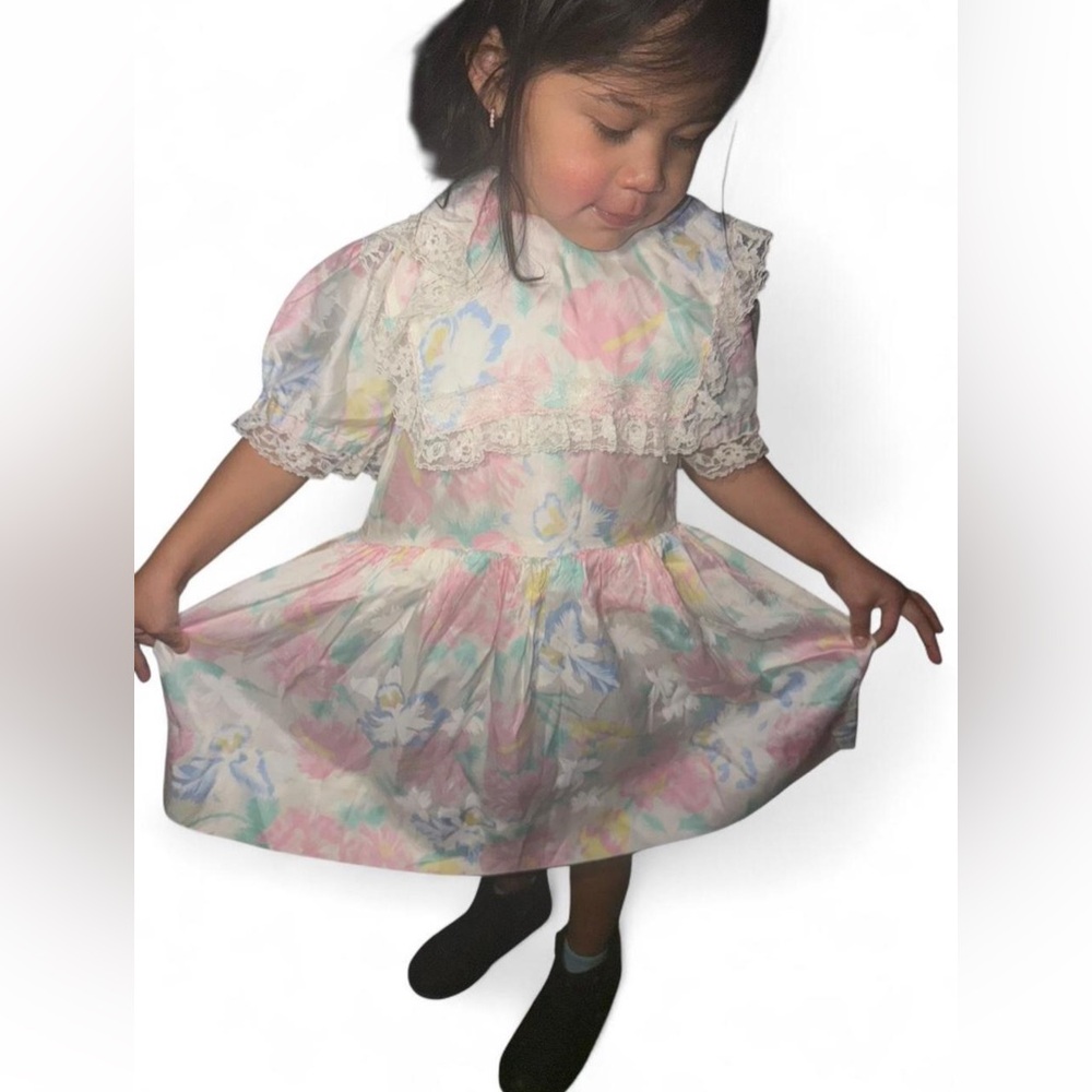 1980s floral dress with lace trim, featuring a pink and white floral design.